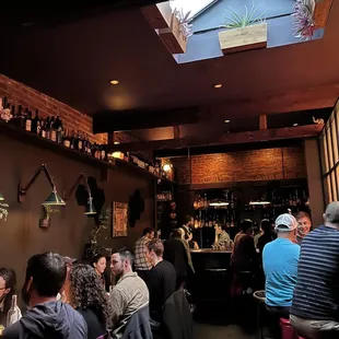 people sitting at tables in a restaurant