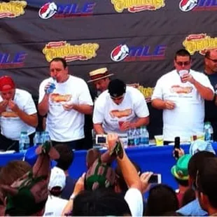 Joey chestnut and other pro eaters stuffing themselves
