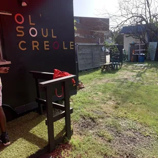 a man standing in front of a black trailer