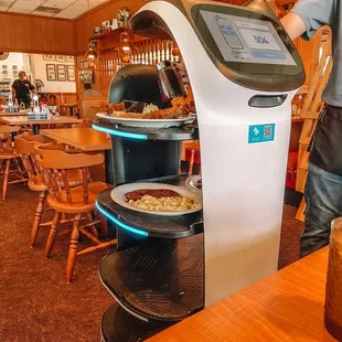  man standing in front of a digital kiosk