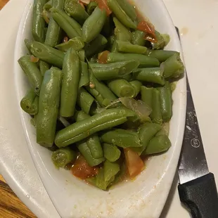 Green beens have onions and tomatoes. Tasty