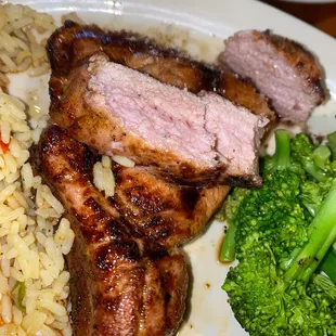 Pork chop cooked to perfection juices pouring out.