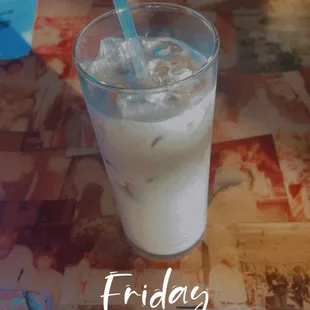 a glass of milk on a table