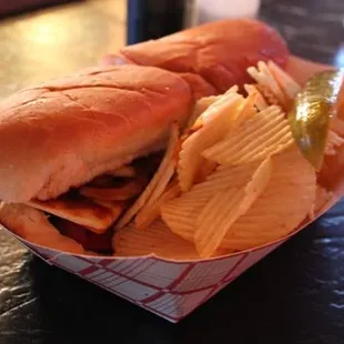 a sandwich and chips on a table
