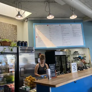 a woman standing at the counter