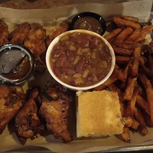 Smoked Wings with sweet potato fries and baked beans.