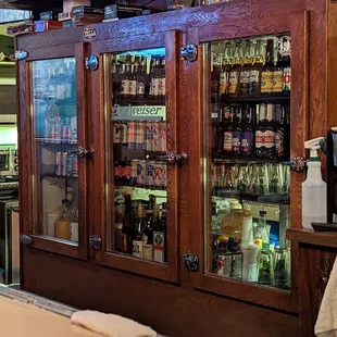 a bar with many bottles of alcohol