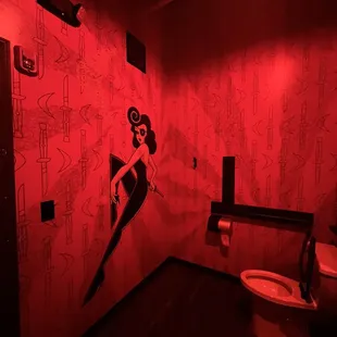 a bathroom with a red light
