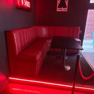 a booth with a red light