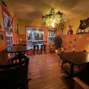 tables and chairs in a brightly lit room