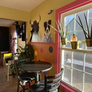 a table and chairs in a brightly colored room