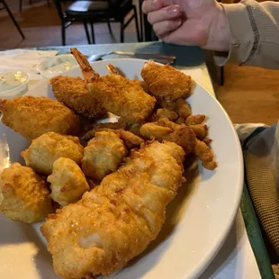 Deep fried seafood platter with cod, shrimp, scallops and clams