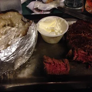 a steak, potatoes, and coleslaw