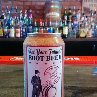 a can of root beer on a bar