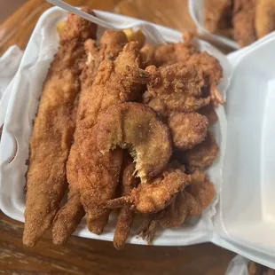 a tray of fried fish and fries