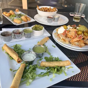 Pork Taquitos, nachos,Duck fat fries and jalapeño wontons.