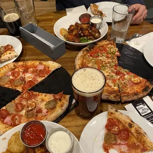 Delicious pizza and wings