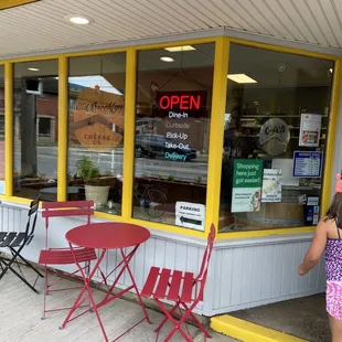 Front entrance and cute little tables outside