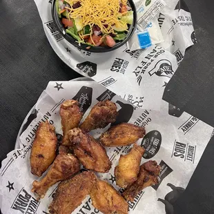 chicken wings and salad