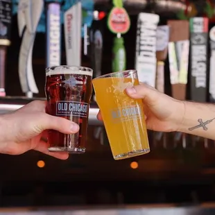 two men toasting at a bar