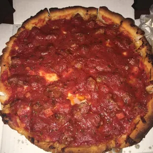 a deep dish pizza in a box