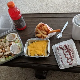 Chicken caesar salad, kid's mac and cheese, fries, pizza puff, gatorade, iced tea.