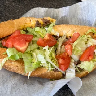 Cheesesteak with grilled onions, peppers and cheese whiz. I also added lettuce and tomato.