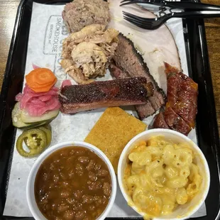 Solo Tray: Smokehouse beans, mac and cheese, ribs, cheddar jalepeno sausage, cornbread, chicken, turkey, brisket, pulled pork.