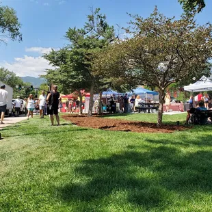 a crowd of people standing and sitting