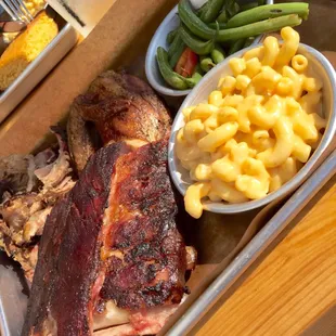 Choose Three: ribs, chicken, bbq pulled pork.Green beans tasted fresh and Mac n cheese was ok.  Good pork!
