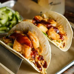 Our Memphis Tacos are always a crowd-pleaser. Two warm flour tortillas filled with your choice of meat, crunchy coleslaw, and beer BBQ sauce