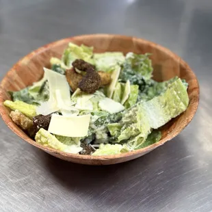 a salad in a wooden bowl