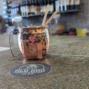 a copper mug on a bar