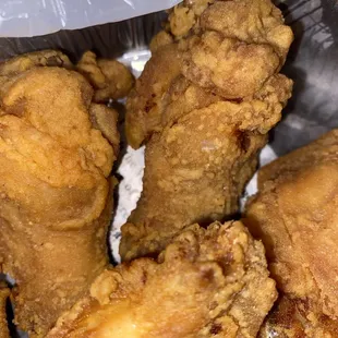 fried chicken in a tin foil container