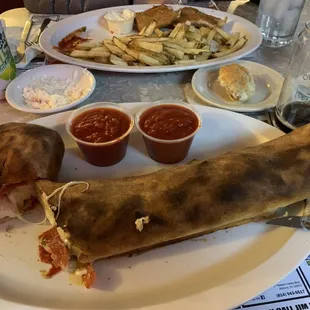 a large burrito and a side of fries