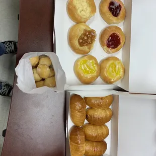 Assorted fruit kolache and small sausage kolaches with a small bag of donut holes
