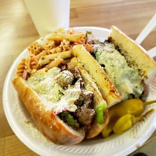 Italian beef sandwich with pasta salad.