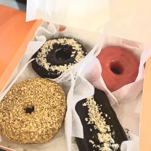 Choco Fudge Glaze, Raspberry Glazed, Peanut Butter, &amp; Boston Cream pictured here