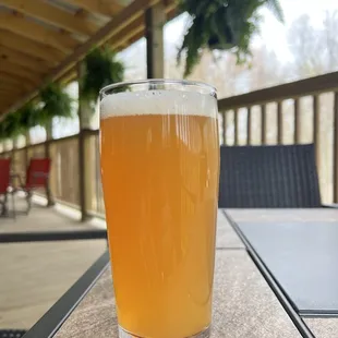 a glass of beer on a table