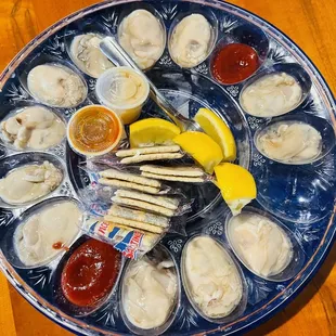 Horrible Gulf oysters served without shelves on the plastic cap. Who does it???