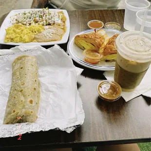 Chorizo Burrito, Chilaquiles Plate with 2 Eggs, Egg Croissandwich, Cafe Latte