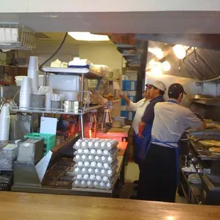View of the grill from the bar -- Old Georgetown Grill kept orders moving quickly during our visit to Saturday brunch.