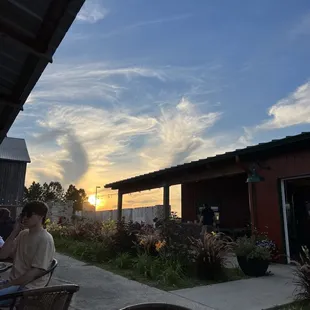 people sitting at a table outside