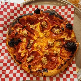 Wood-fired sausage and pepperoni pizza