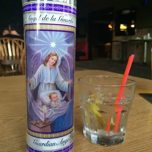 a candle and a glass of water