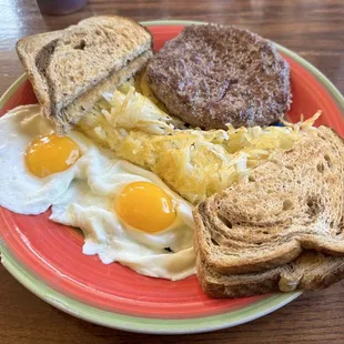 Chopped steak with eggs, hash browns and toast