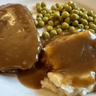 Senior meatloaf dinner with mashed potatoes and peas