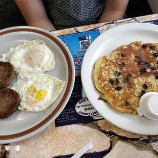 the NEW Chocolate chip pancake breakfast. (fried eggs, sausage)