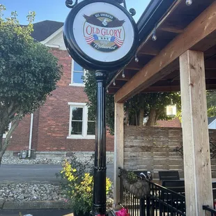 Sign by their outdoor seating area