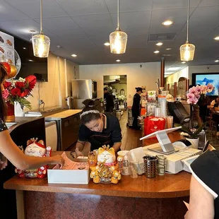 a woman serving food to a child
